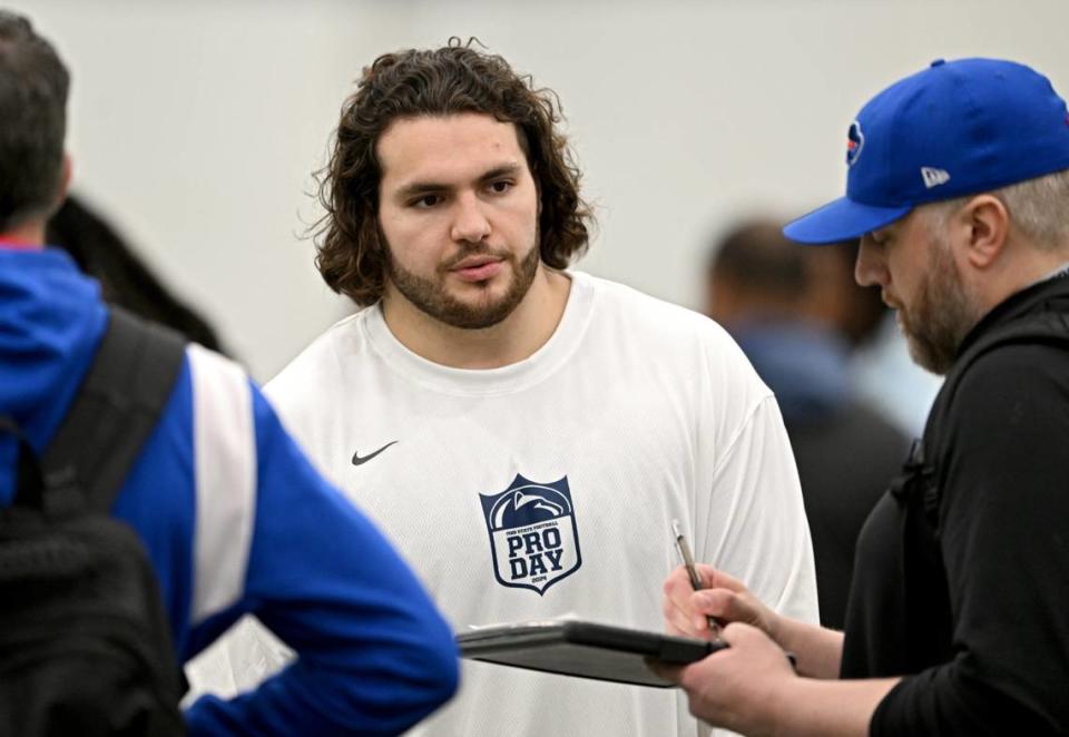 Offensive lineman Hunter Nourzad talks to NFL scouts during Penn State’s Pro Day on Friday, March 15, 2024 in Holuba Hall.
