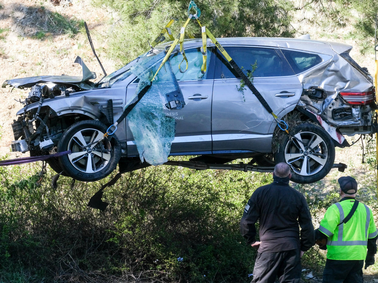 <p>Investigators recover the vehicle of Tiger Woods following 23 February crash</p> (AP)