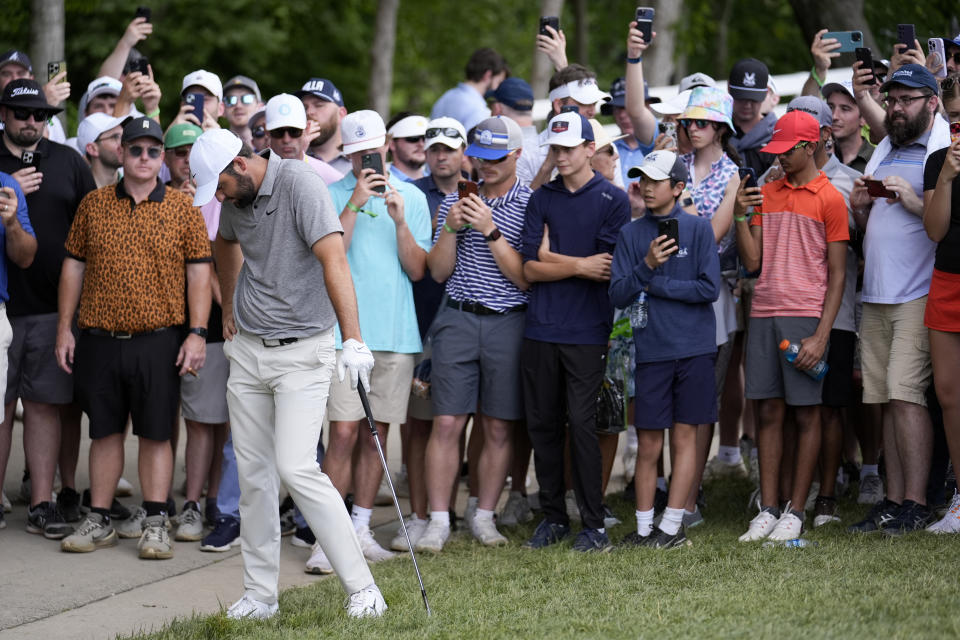 Scottie Scheffler reacts to his chip to the green on the fourth hole during the third round of the PGA Championship golf tournament at the Valhalla Golf Club, Saturday, May 18, 2024, in Louisville, Ky. (AP Photo/Jeff Roberson)