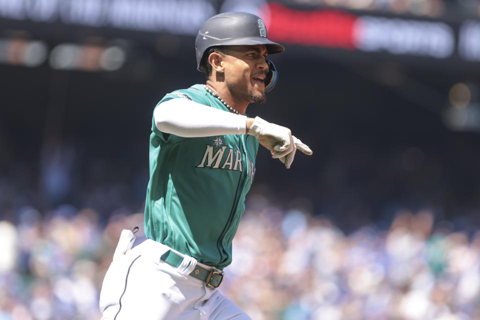 Seattle Mariners' Julio Rodriguez celebrates after hitting a solo home run during the third inning of a baseball game against the Toronto Blue Jays, Saturday, July 22, 2023, in Seattle. (AP Photo/Jason Redmond)