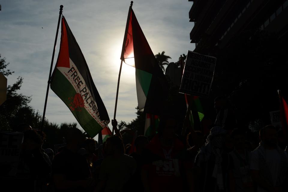 Demonstrators, Palestinians and community members rallied and marched through part of downtown Tampa Friday evening, calling for the end of the Israeli-Hamas conflict and the peaceful existence of Palestinians in Tampa Bay and across the globe.