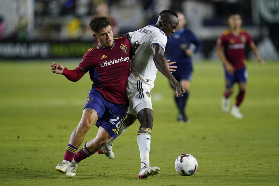 Real Salt Lake midfielder Diego Luna (26) and LA Galaxy defender Séga Coulibaly (4) vie for the ball during the second half of an MLS soccer match in Carson, Calif., Saturday, Oct. 1, 2022. (AP Photo/Ashley Landis)