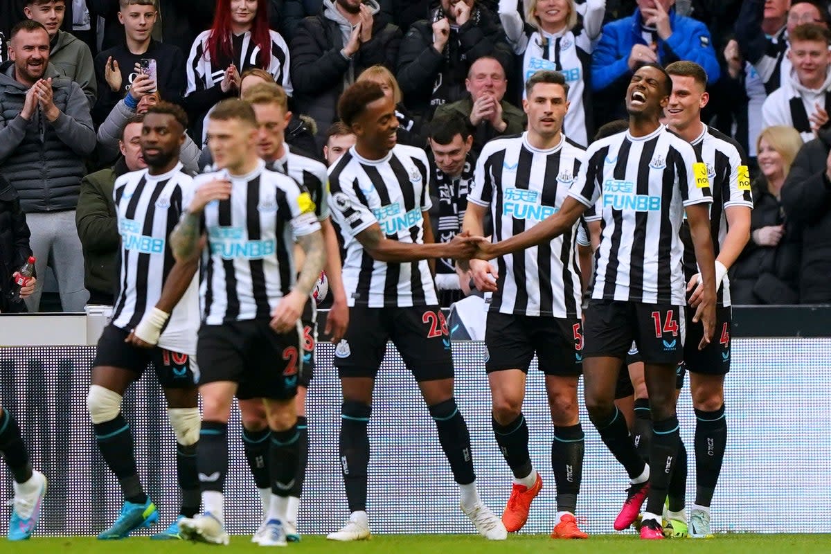 Newcastle’s Alexander Isak (second right) celebrates scoring the opening goal against Wolves (Owen Humphreys/PA) (PA Wire)