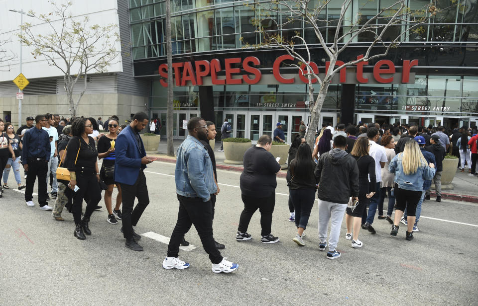 Guests file into the Staples Center to attend the Celebration of Life memorial service for late rapper Nipsey Hussle, whose given name was Ermias Asghedom, on Thursday, April 11, 2019, in Los Angeles. (Photo by Chris Pizzello/Invision/AP)