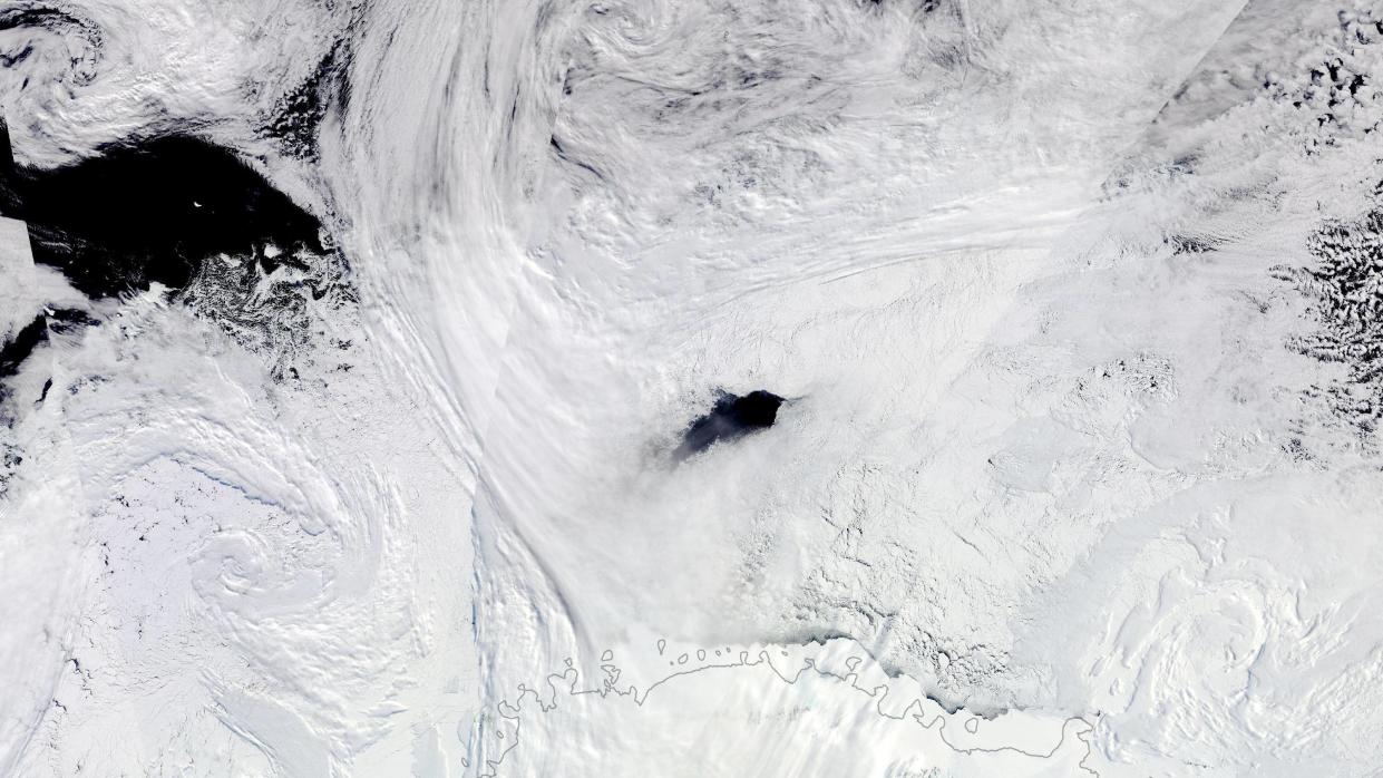  Satellite photo showing a dark-blue hole in antarctic sea ice. 