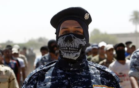 Shi'ite volunteers, who have joined the Iraqi army to fight against militants of the Islamic State, formerly known as the Islamic State of Iraq and the Levant (ISIL), march during training in Baghdad, July 9, 2014. REUTERS/Ahmed Saad