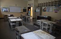 A classroom stands empty at the Fe y Alegria school in Caracas, Venezuela, Tuesday, April 28, 2020. Classes have been suspended in Venezuela since March 13, due to the quarantine decreed to avoid the spread of the new coronavirus. (AP Photo/Ariana Cubillos)