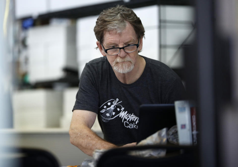 FILE - In this Monday, June 4, 2018, file photograph, baker Jack Phillips, owner of Masterpiece Cakeshop, manages his shop after the U.S. Supreme Court ruled that he could refuse to make a wedding cake for a same-sex couple because of his religious beliefs did not violate Colorado's anti-discrimination law in Lakewood, Colo. Attorneys for Philliups are in federal court in Denver Tuesday, Dec. 18, 2018, to seek to overturn a Colorado Civil Rights Commission ruling that the baker discriminated against a transgender person by refusing to make a cake to mark the person's transition from male to female. (AP Photo/David Zalubowski, File)