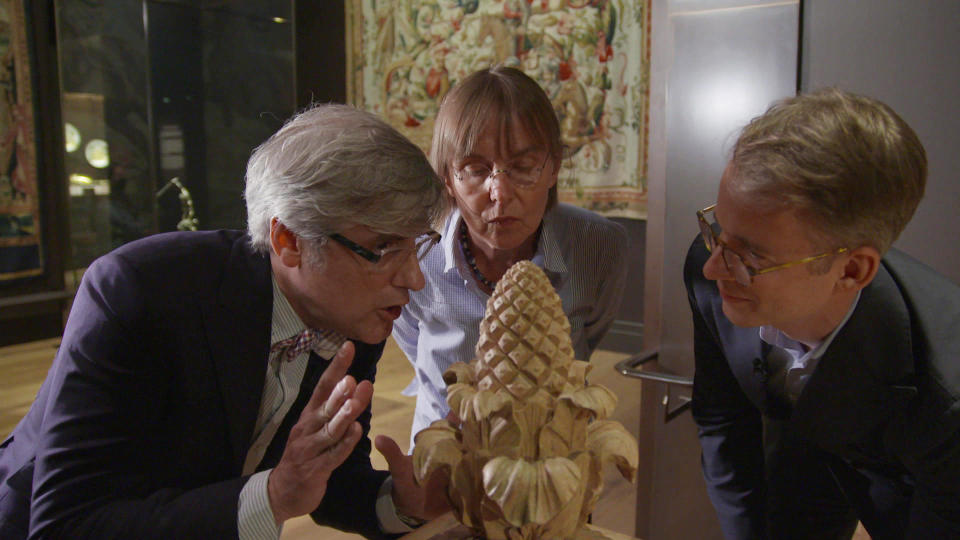 A pine cone or a pineapple? Correspondent Mo Rocca with conservator Mecka Baumeister and associate curator Wolf Burchard.   / Credit: CBS News