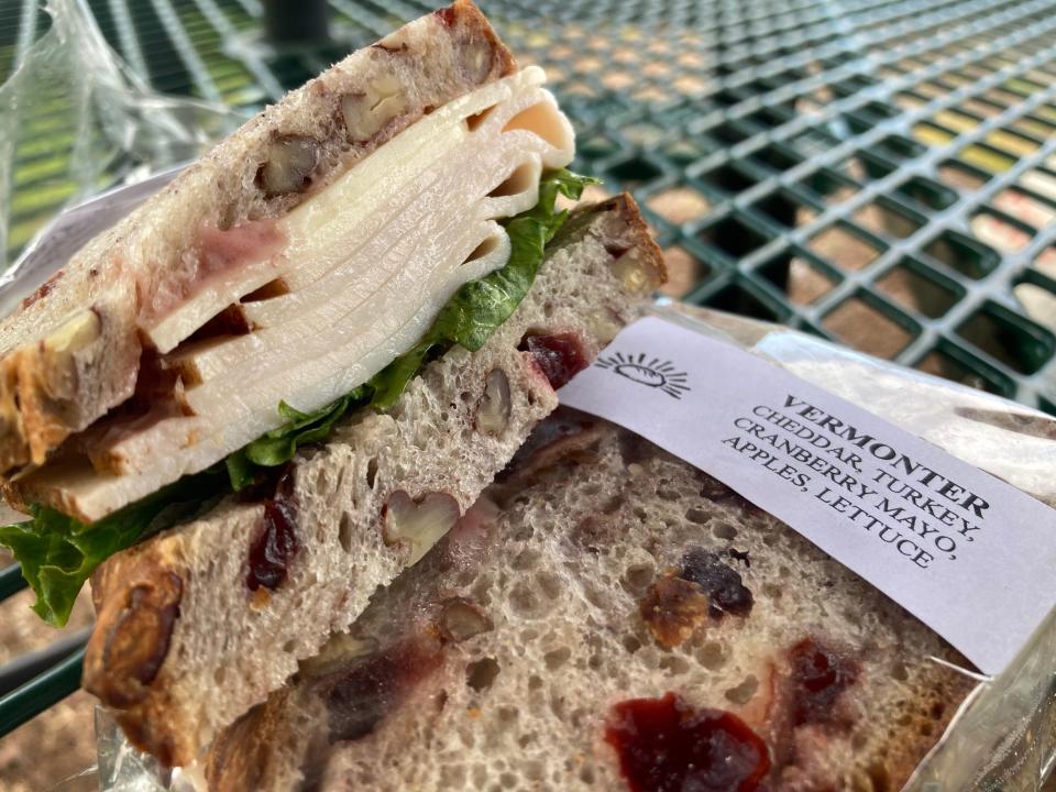 A Vermonter sandwich - turkey, cheddar, cranberry mayonnaise, Granny Smith apple slices and lettuce on sourdough-based cranberry-pecan bread - from Klinger's Bread Co. in South Burlington, shown Aug. 15, 2023.