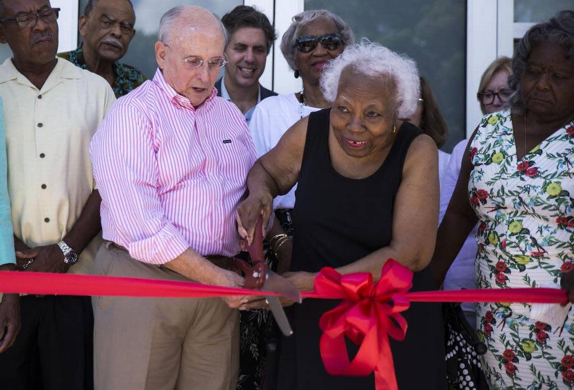 Then-Coral Gables Mayor Raúl J. Valdés-Fauli and Leona Ferguson Cooper cut the red ribbon on July 1, 2017, during the grand opening of the long-delayed community center at the Lola B. Walker Homeowners Association in Coral Gables.