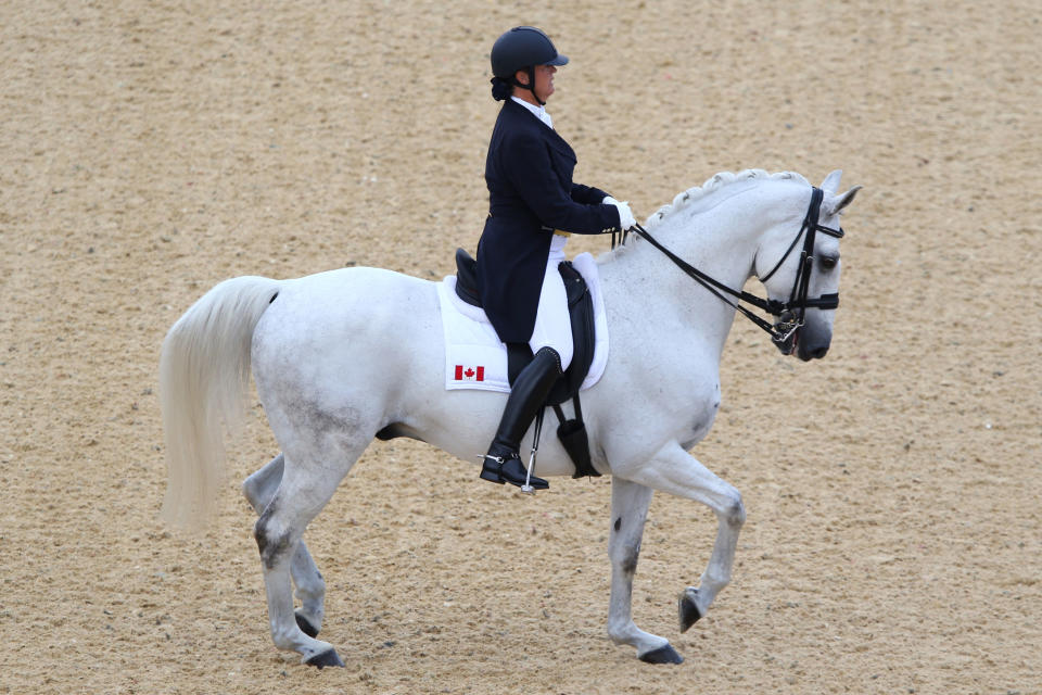 LONDON, ENGLAND - AUGUST 02: Jacqueline Brooks of Canada riding DNiro competes in the Dressage Grand Prix on Day 6 of the London 2012 Olympic Games at Greenwich Park on August 2, 2012 in London, England. (Photo by Alex Livesey/Getty Images)