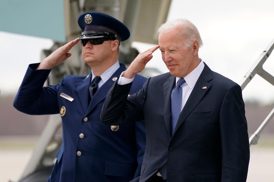 President Joe Biden salutes as he steps off Air Force One at Portsmouth International Airport at Pease in Portsmouth, N.H., Tuesday, April 19, 2022. Biden was in New Hampshire to promote his infrastructure agenda. (AP Photo/Patrick Semansky)