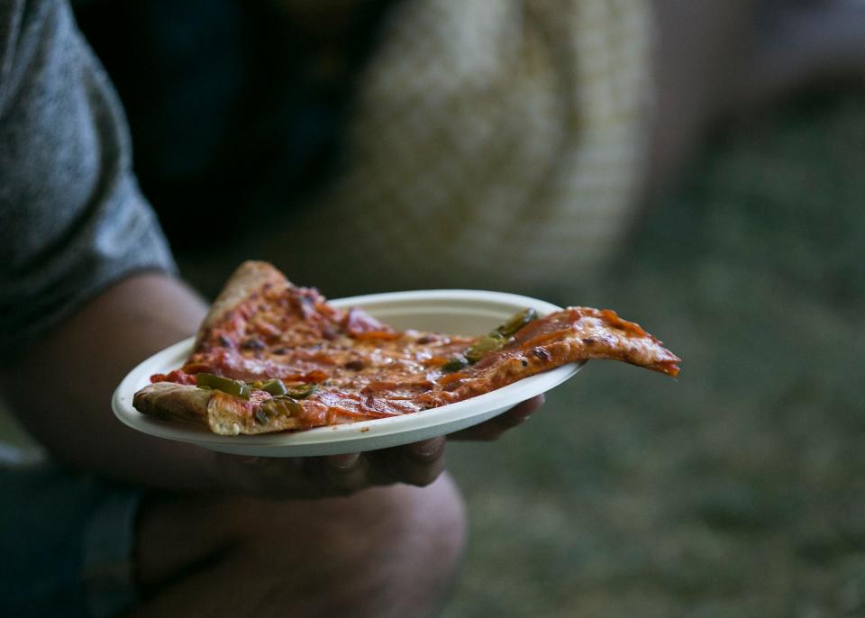 Festival goers eat food inside the Indio Central Market at Coachella 2019 in Indio, Calif. on Sat. April 13, 2019. 