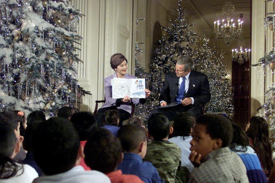 Laura Bush and George W. Bush read a story to schoolchildren in December 2001.