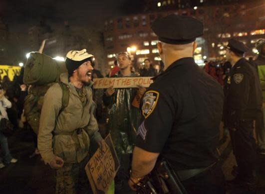 A man affiliated with Occupy Wall Street yells at police officers before the NYPD confronted protesters who are camping in Union Square in New York March 21, 2012.