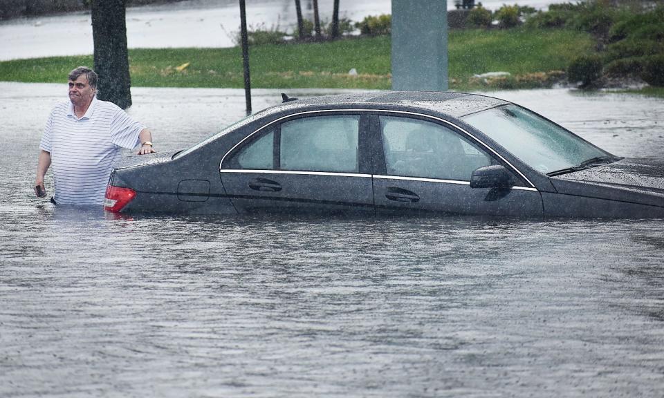 A motorist was stranded at the intersection of Pleasant and Quarry streets in Fall River during a downpour this summer.