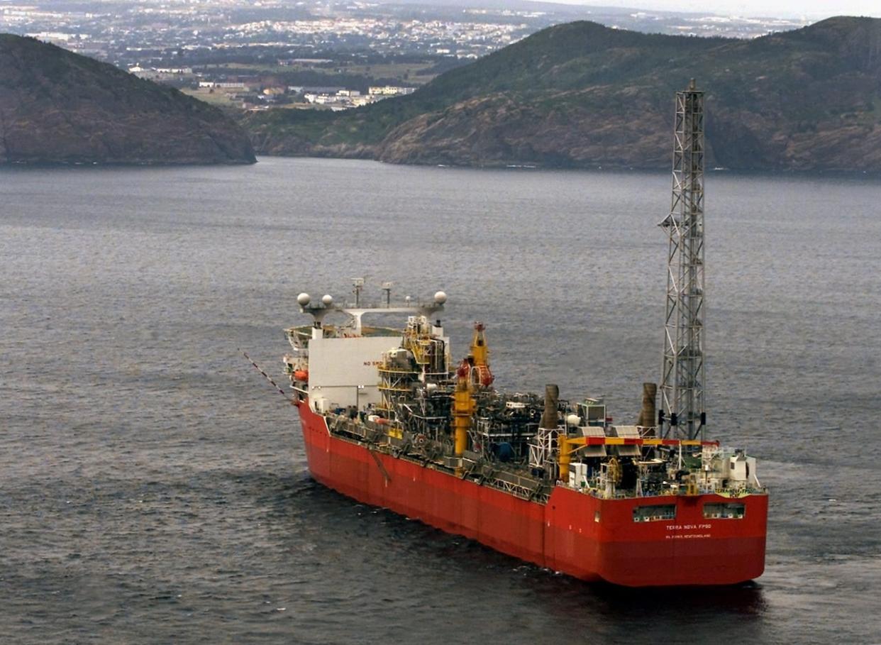 Terra Nova FPSO, a massive floating production, storage and offloading vessel used in the oil and gas industry, heads along the Newfoundland coast near St. John's on Friday, Aug. 3, 2001.  (Andrew Vaughan/The Canadian Press - image credit)