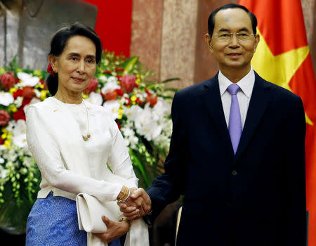 Myanmar's State Counsellor Aung San Suu Kyi (L) meets Vietnam's President Tran Dai Quang at the Presidential Palace during the World Economic Forum on ASEAN in Hanoi, Vietnam September 13, 2018. REUTERS/Kham/Pool