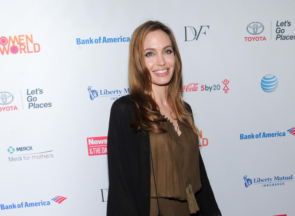 FILE - In this April 4, 2013 file photo, actress Angelina Jolie attends the 4th Annual Women in the World Summit at the David H. Koch Theater, in New York. The honorary Academy Awards go to Jolie, Steve Martin, Angela Lansbury and Italian costume designer Piero Tosi. The film academy announced Thursday, Sept. 5, 2013, that Jolie will receive the Jean Hersholt Humanitarian Award, while Martin, Lansbury and Tosi will get Oscars recognizing their career achievements. (Photo by Evan Agostini/Invision/AP, File)