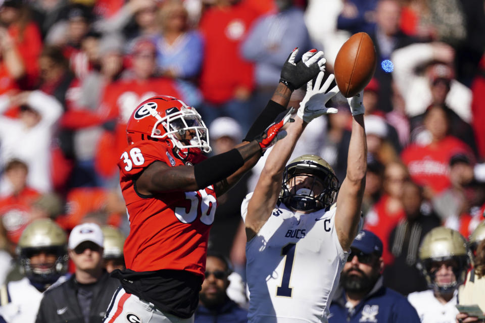Georgia defensive back Latavious Brini (36) breaks up a pass intended for Charleston Southern wide receiver Garris Schwarting (1) in the first half of an NCAA college football game Saturday, Nov. 20, 2021, in Athens, Ga. (AP Photo/John Bazemore)