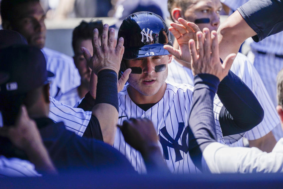 New York Yankees' Anthony Rizzo celebrates after scoring on an error in the eighth inning of a baseball game against the Detroit Tigers, Sunday, June 5, 2022, in New York. (AP Photo/Mary Altaffer)