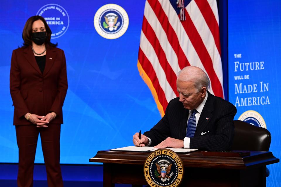 <p>President Joe Biden with Vice President Kamala Harris signs a “Made in America” Executive Order, to increase the amount of federal spending that goes to US companies</p> (Getty)