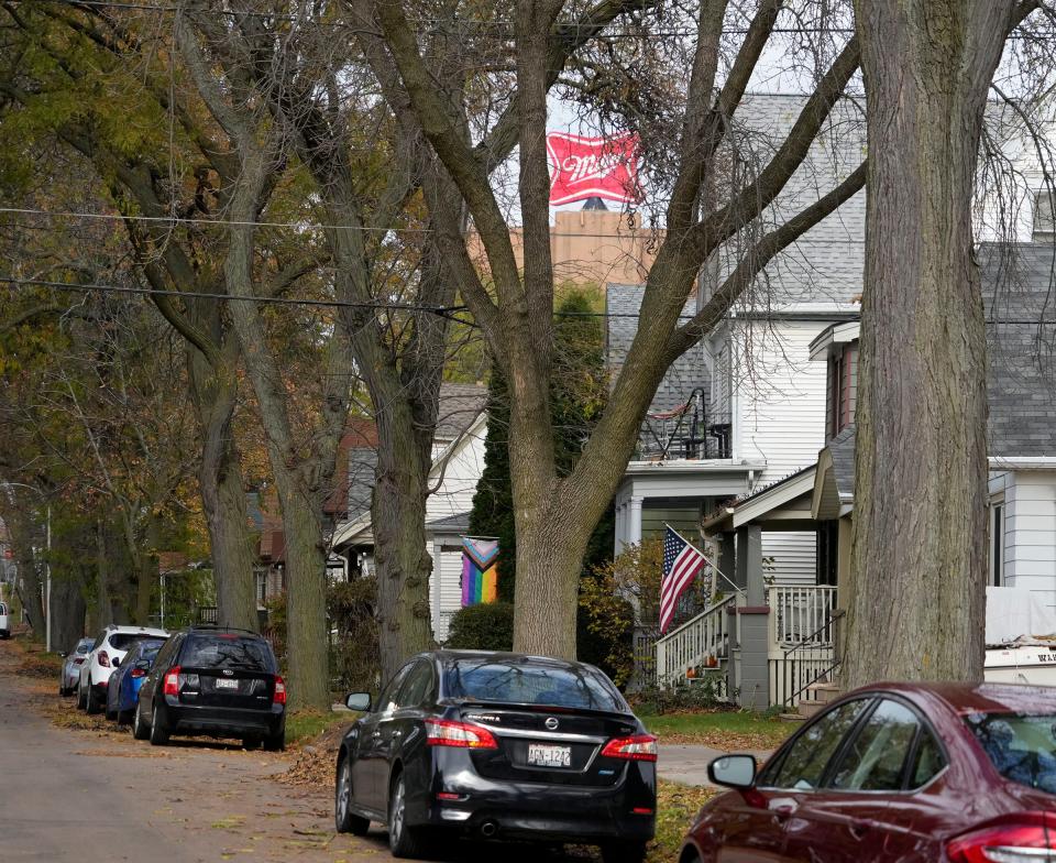 The Miller Brewery sign is seen through a tree lined North 40th Street just south of West Clybourn Street in the Piggsville neighborhood.