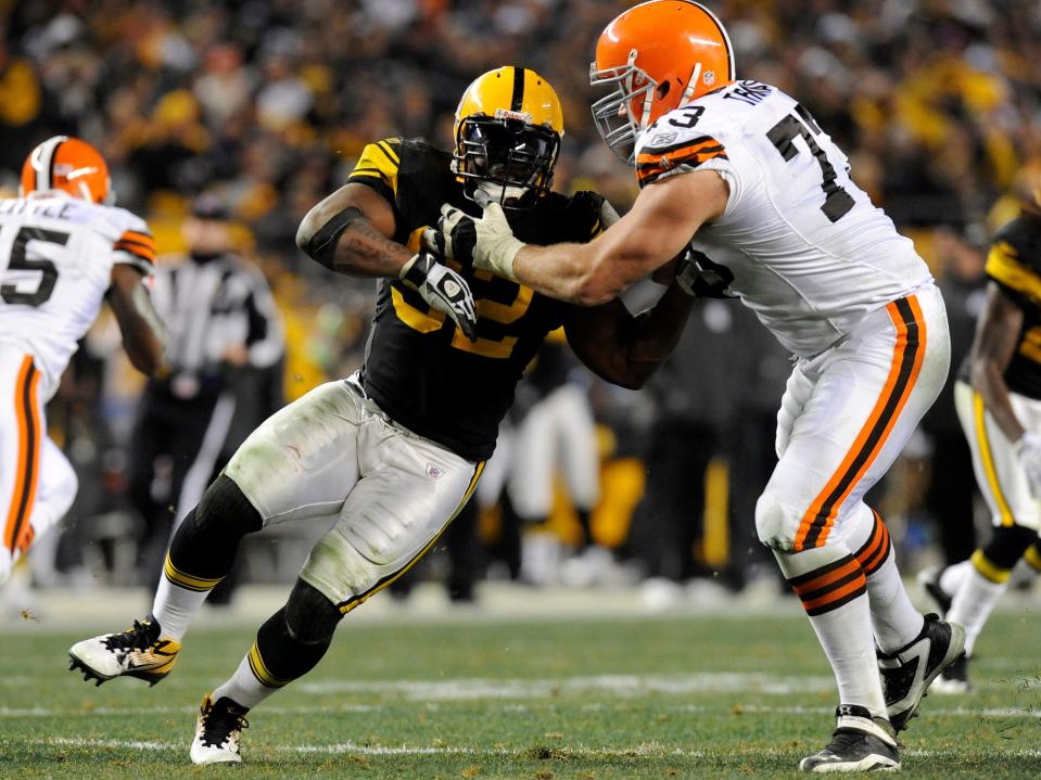 Cleveland Browns offensive tackle Joe Thomas (73) blocks Pittsburgh Steelers outside linebacker James Harrison (92) during the third quarter of an NFL football game Thursday, Dec. 8, 2011, in Pittsburgh. Pittsburgh won 14-3.(AP Photo/Don Wright)