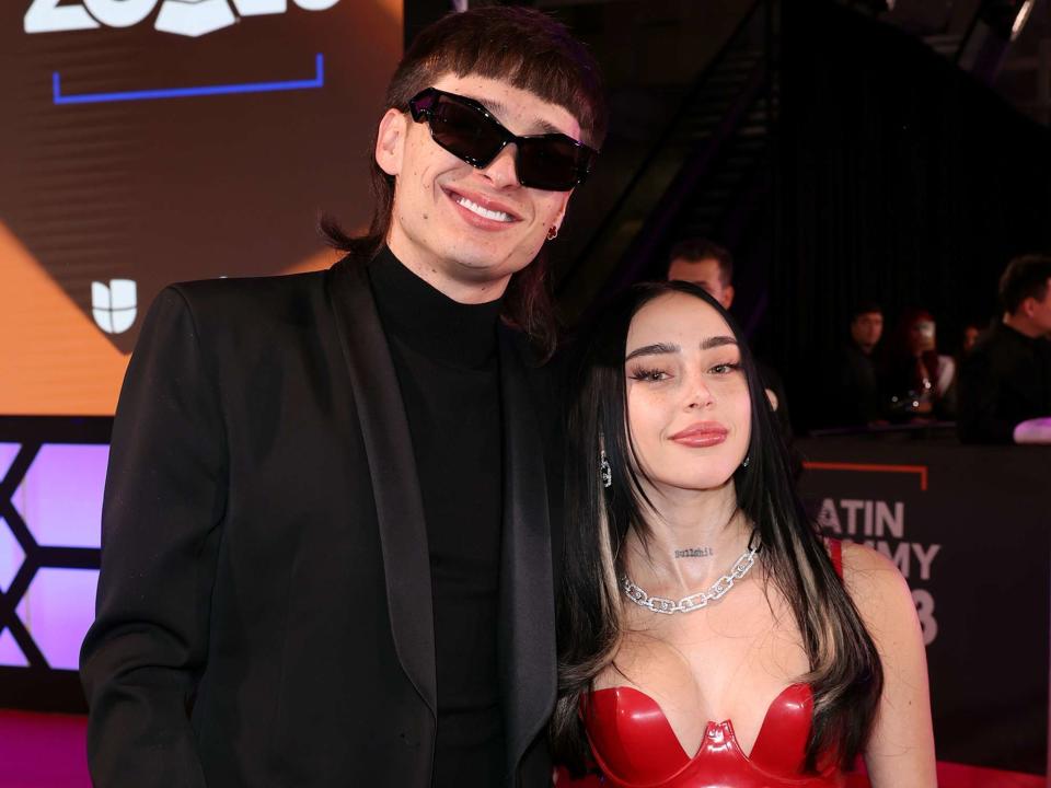 <p>Rodrigo Varela/Getty</p> Peso Pluma and Nicki Nicole attend the 24th Annual Latin Grammy Awards in November 2023 in Seville, Spain