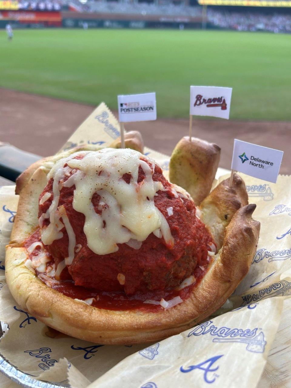 •	Whole ‘Nother Ball Game: Gigantic all-beef Italian meatball braised in San Marzano pomodoro sauce for 2 hours, topped with fresh mozzarella cheese and sauce nuzzled in a glove-inspired bread bowl lightly brushed with basil pesto sauce and extra virgin olive oil. Available at 1871 Grille near section 113.