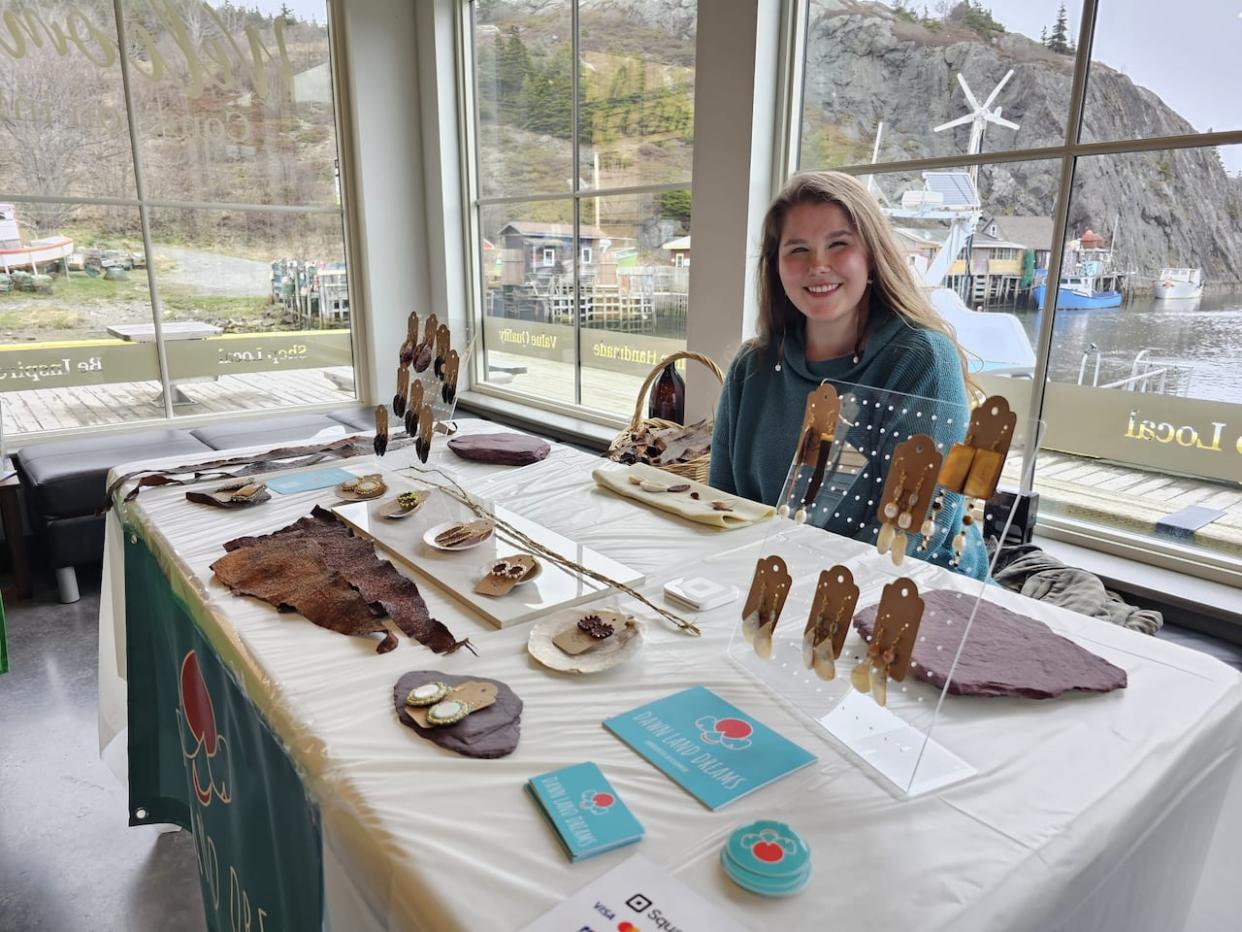 Isabella White says Saturday was her first market. She says the program aimed to help Indigenous youth learn business skills was the push she needed to start selling her art. (Arlette Lazarenko/CBC - image credit)