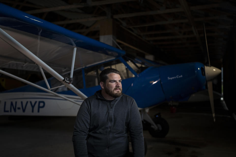 Aviator and adventurer Garrett Fisher poses for a portrait in Voss, Norway, on Aug. 2, 2022. Fisher is on a mission to photograph all the remaining glaciers that are not in the polar regions before they disappear. (AP Photo/Bram Janssen)