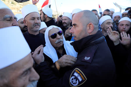 Druze Arabs on the Israeli-occupied Golan Heights hold an anti-election protest outside a municipal polling station in Majdal Shams, October 30, 2018 REUTERS/Ammar Awad