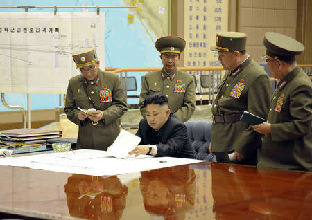 North Korean leader Kim Jong-un presides over an urgent operation meeting on the Korean People's Army Strategic Rocket Force's performance of duty for firepower strike at the Supreme Command in Pyongyang, March 29, 2013. REUTERS/KCNA