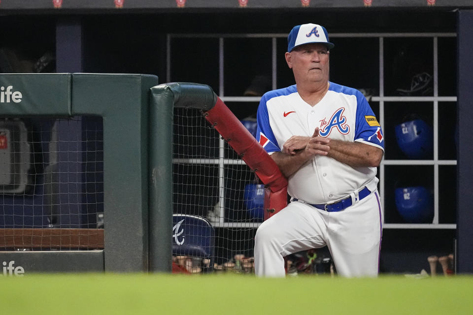 Atlanta Braves manager Brian Snitker watches from the dugout during the team's baseball game against the Milwaukee Brewers on Saturday, July 29, 2023, in Atlanta. (AP Photo/John Bazemore)