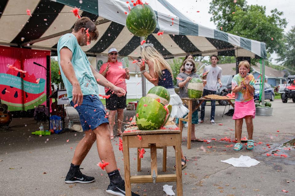 Nic Kadel, 18, and his teammate Isabella Gray, 17, react after making their watermelon explode from pressure caused by rubber bands during the 70th Annual Monticello Watermelon Festival Saturday, June 19, 2021.