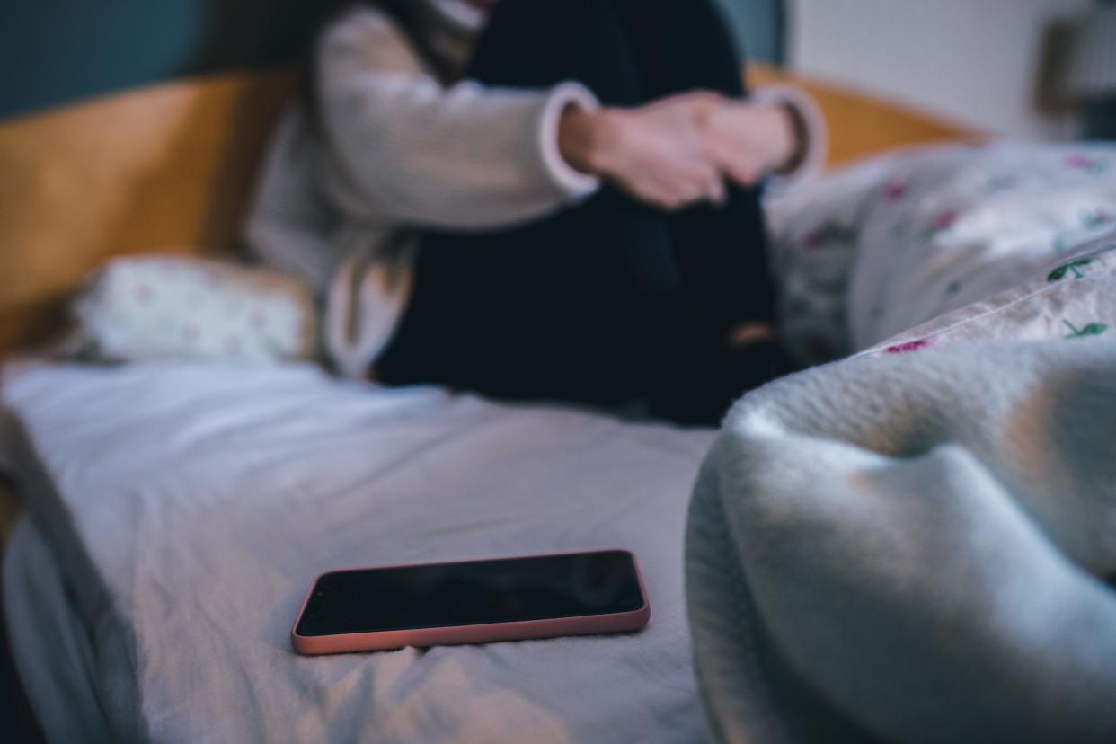 Teen with phone in room