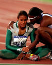 <p>Freeman sits on the track after claiming gold.</p>