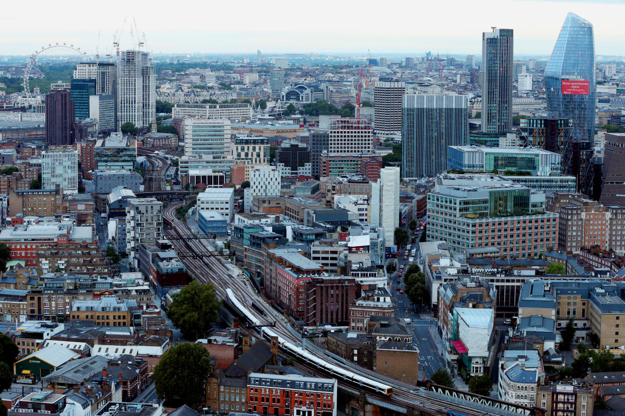 A view over northern parts of Southwark and Lambeth with the London Eye at left and the South Bank Tower and One Blackfriars at right, as seen from the roof of Guy's Hospital, London.