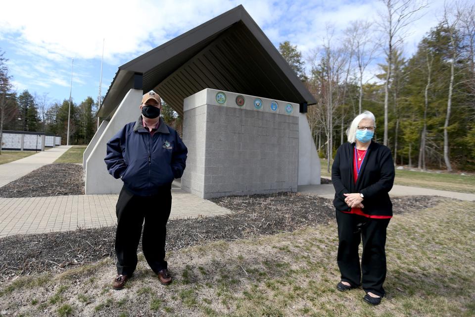 Maine State Rep. John Tuttle and Christine Pratt, a civilian office associate at Southern Maine Veterans Cemetery, stand in front of the plot of land that would be designated for Pratt’s burial at the cemetery, if the state and federal government grant special permission for her to be buried there.