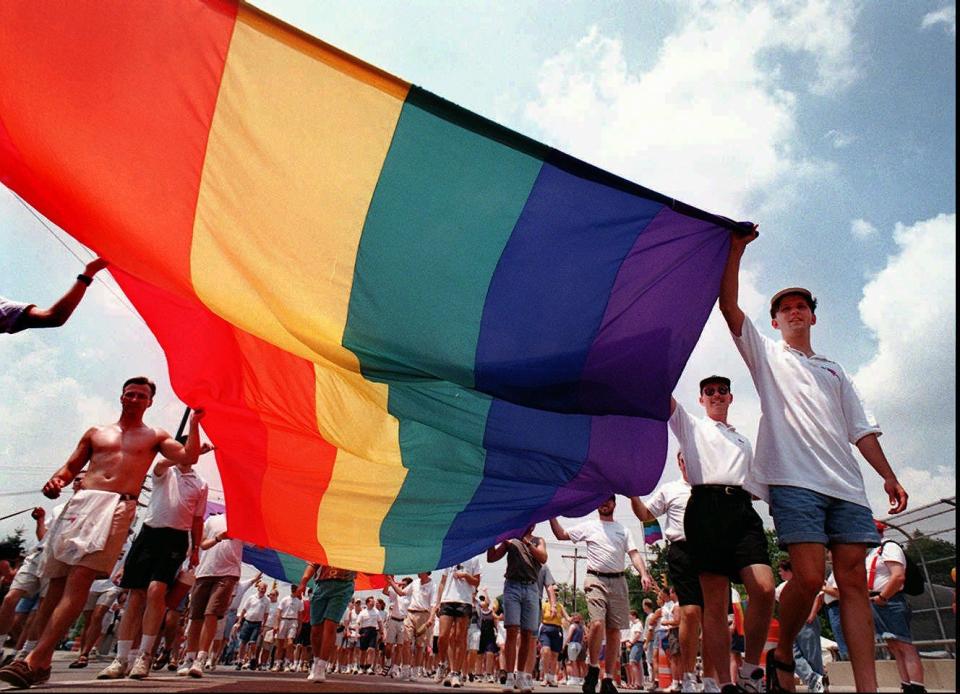 Participants in the 1995 Gay Pride Parade and Festival carry a banner Sunday, June 25, 1995, in Columbus, Ohio. About 5,000 people gathered for the event, sponsored by the local chapter of Stonewall Union, a gay-rights organization.