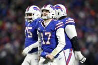 Buffalo Bills quarterback Josh Allen (17) celebrates after wide receiver Gabriel Davis (13) scores a touchdown during the second half of an NFL wild-card playoff football game against the New England Patriots, Saturday, Jan. 15, 2022, in Orchard Park, N.Y. (AP Photo/Joshua Bessex)