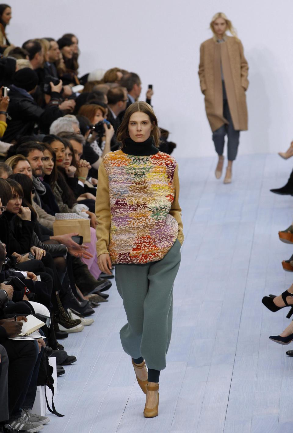 A model wears a creation by designer fashion designer Clare Waight Keller for Chloe as part of the Fall-Winter, ready-to-wear 2013 fashion collection, during Paris Fashion week, Monday, March. 5, 2012. (AP Photo/Christophe Ena)