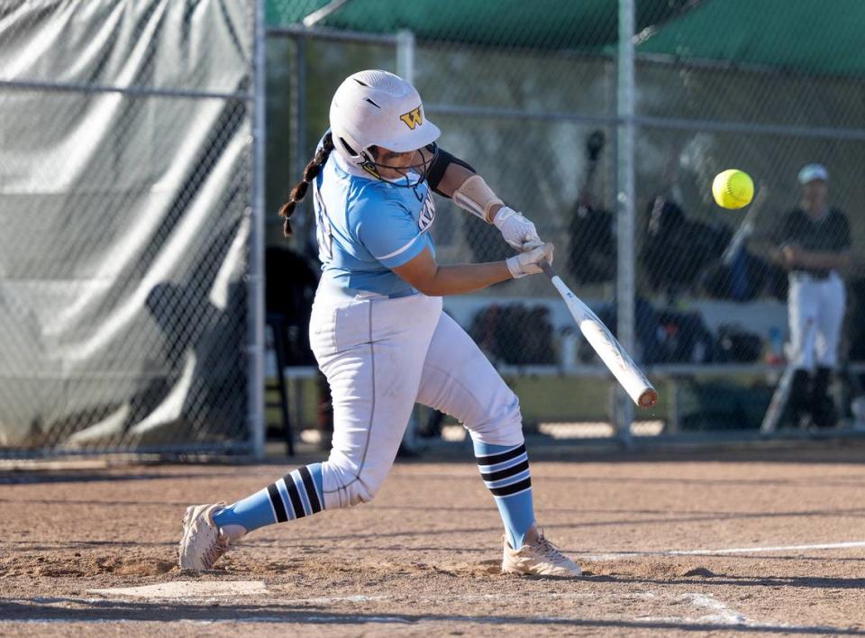 Downey’s Maddy Flores hits a double during the Central California Athletic League game with Pitman at Pitman High School in Turlock, Calif., Tuesday, March 19, 2024.