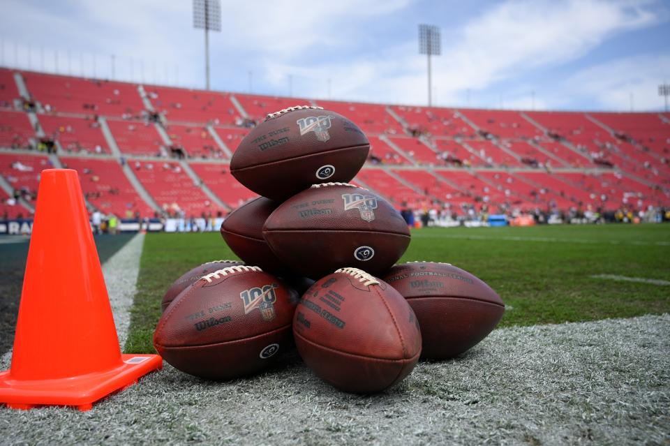 Footballs are stacked up before an NFL football game between the Los Angeles Rams and the New Orleans Saints Sunday, Sept. 15, 2019, in Los Angeles. (AP Photo/Mark J. Terrill)