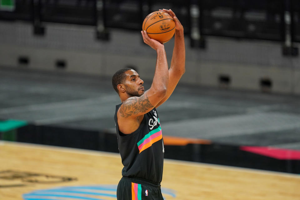 Jan 22, 2021; San Antonio, Texas, USA; San Antonio Spurs center LaMarcus Aldridge (12) shoots in the first half against the Dallas Mavericks at the AT&T Center. 