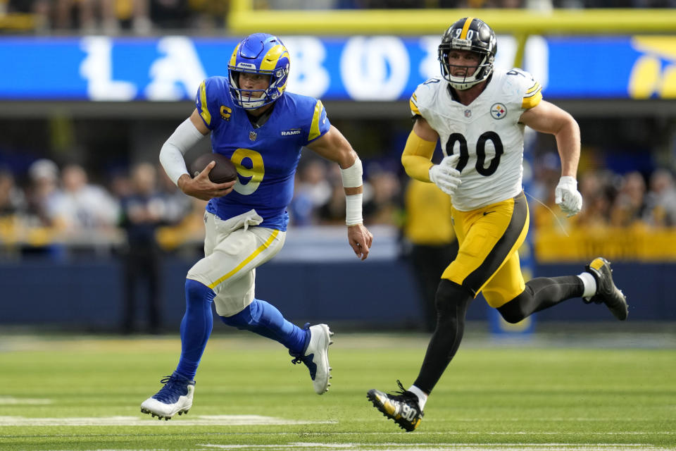 Los Angeles Rams quarterback Matthew Stafford (9) runs the ball as Pittsburgh Steelers linebacker T.J. Watt (90) gives chase during the second half of an NFL football game Sunday, Oct. 22, 2023, in Inglewood, Calif. (AP Photo/Ashley Landis)