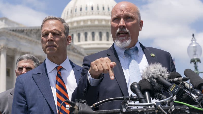 Rep. Scott Perry, R-Pa., left, and Rep. Chip Roy, R-Texas, speak with reporters as member of the conservative House Freedom Caucus talk about the debt limit deal, during a news conference, Tuesday, May 30, 2023, on Capitol Hill in Washington.