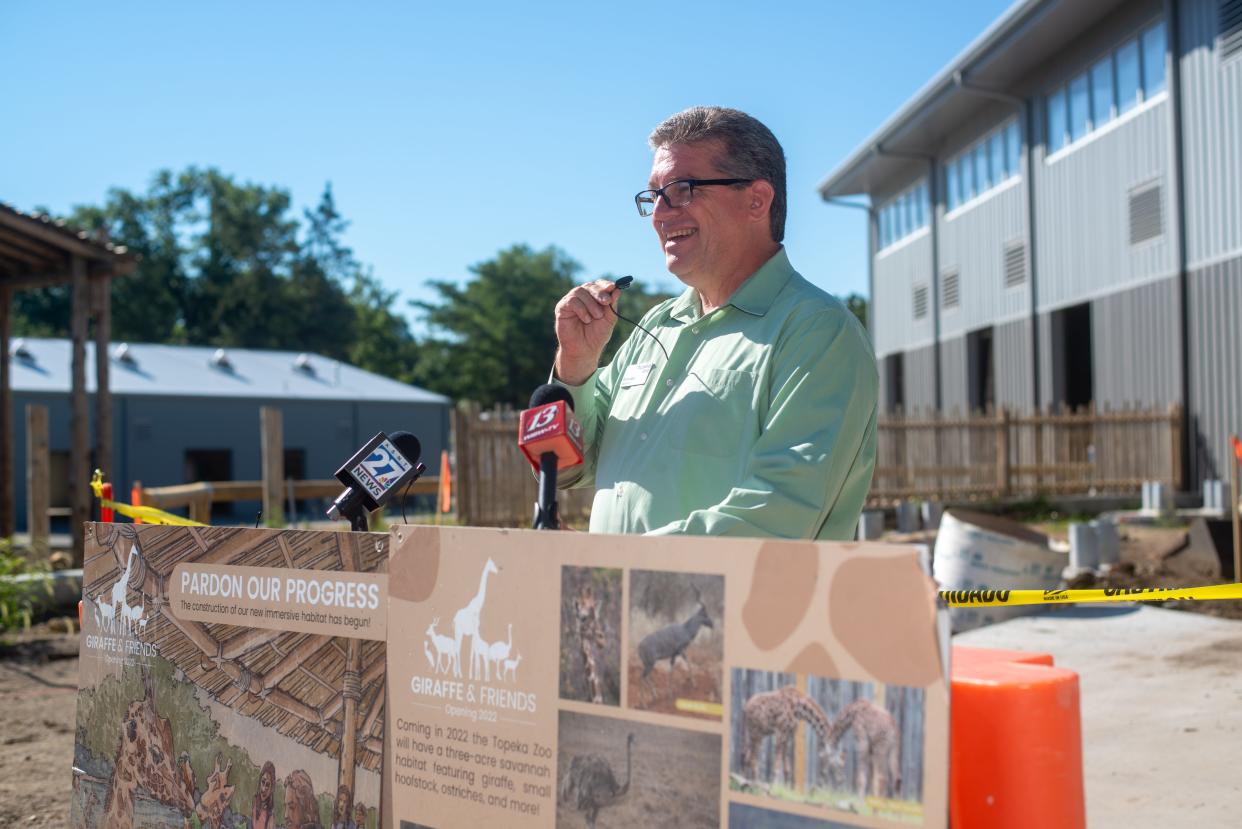 Construction continues in the background as Topeka Zoo director Brendan Wiley gives an update at a news conference Wednesday regarding plans for the zoo's Giraffe and Friends exhibit. The zoo's three giraffes are expected to be moved in late September to their new enclosure at that exhibit, which is expected to open March 10.